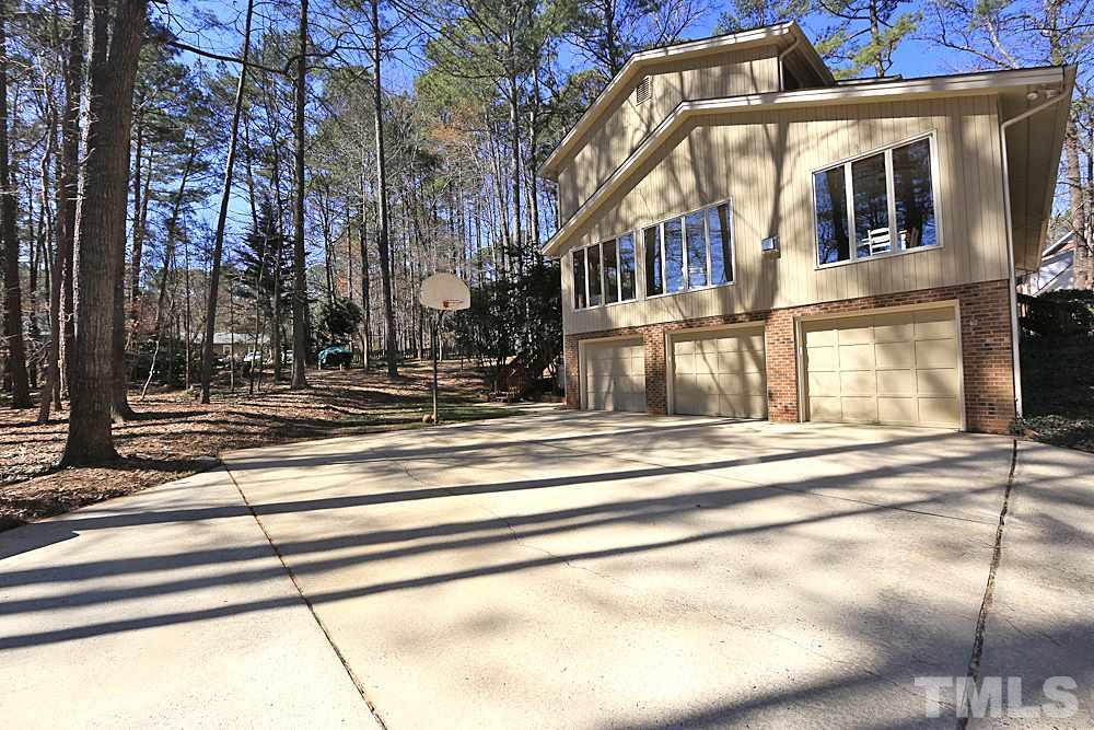 11716 Appaloosa Run East Raleigh, NC 27613 - Photo 3 of 30 Hard to find 3 car garage with large parking pad area.