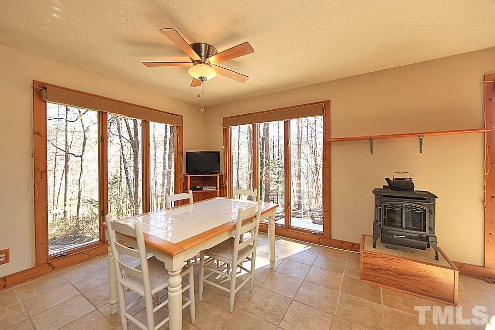 11716 Appaloosa Run East Raleigh, NC 27613 - Photo 9 of 30 Enjoy eating in this bright eating nook with a gas stove.