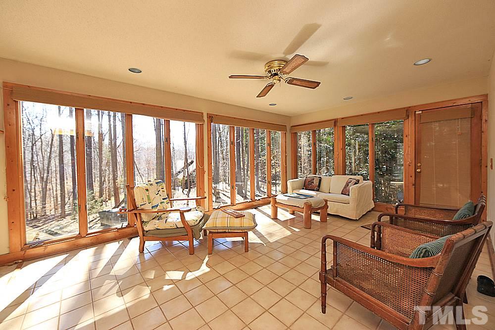 11716 Appaloosa Run East Raleigh, NC 27613 - Photo 10 of 30 Lovely light filled sunroom has floor to ceiling Anderson windows on all 3 sides and easy to maintain tile flooring.