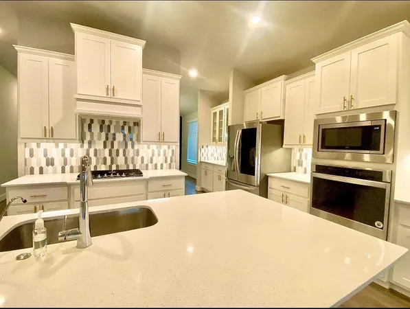 a kitchen with a sink and a microwave