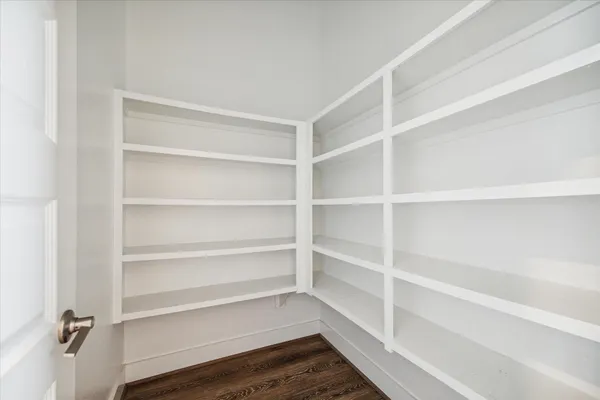 a kitchen with stainless steel appliances granite countertop a sink and a refrigerator