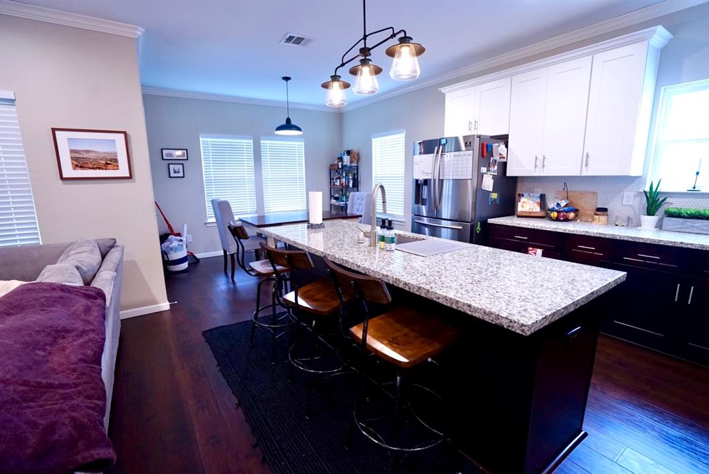 a view of kitchen island with granite countertop living room