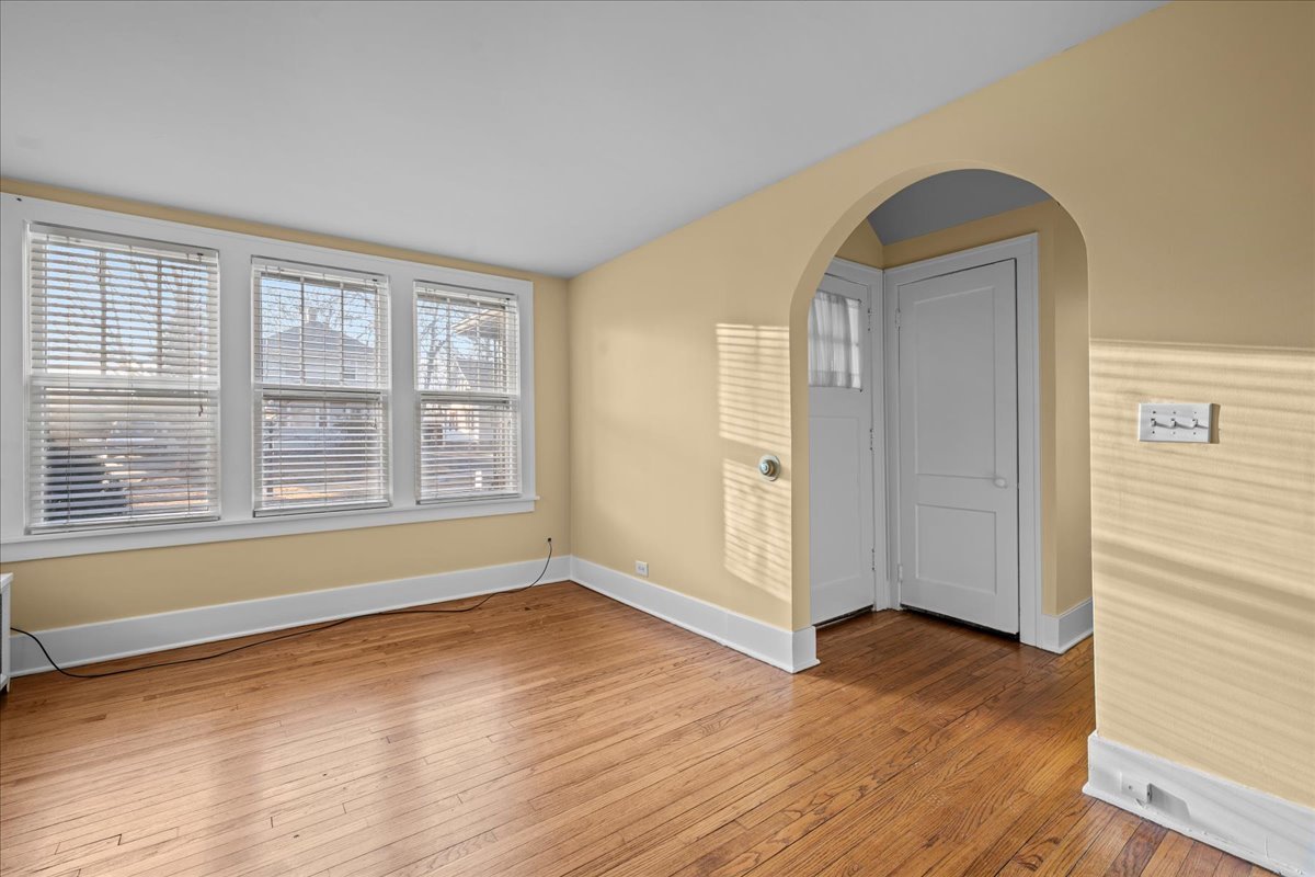 1211 Griffith Road Lake Forest, IL 60045 - Photo 3 of 15 an empty room with wooden floor and windows