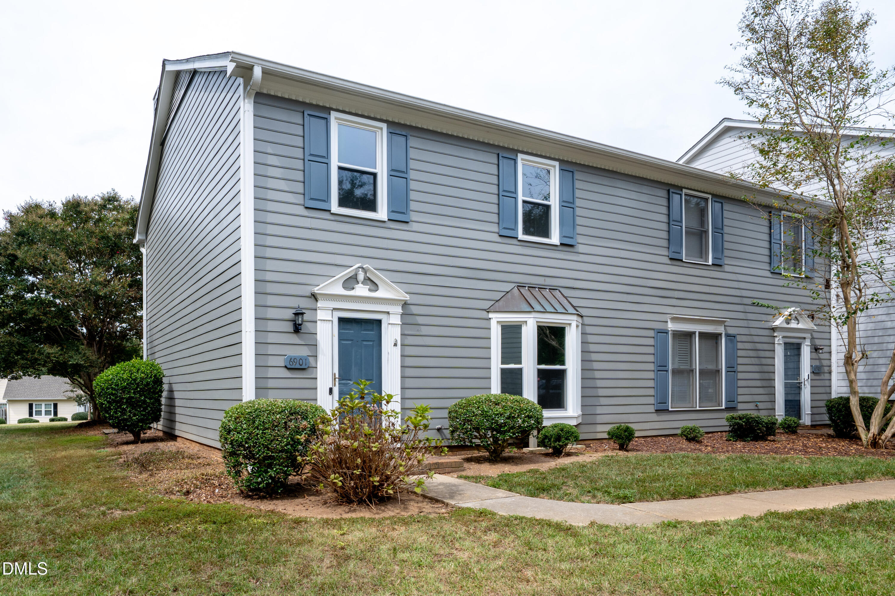 6901 Saxby Court Raleigh, NC 27613 - Photo 1 of 36 a front view of a house with a yard