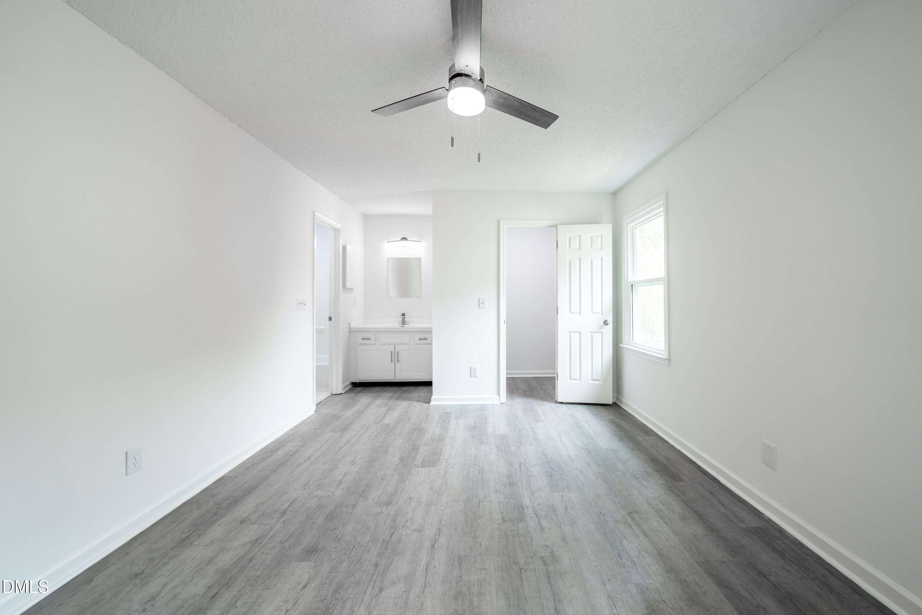 6901 Saxby Court Raleigh, NC 27613 - Photo 10 of 36 wooden floor in an empty room with a window