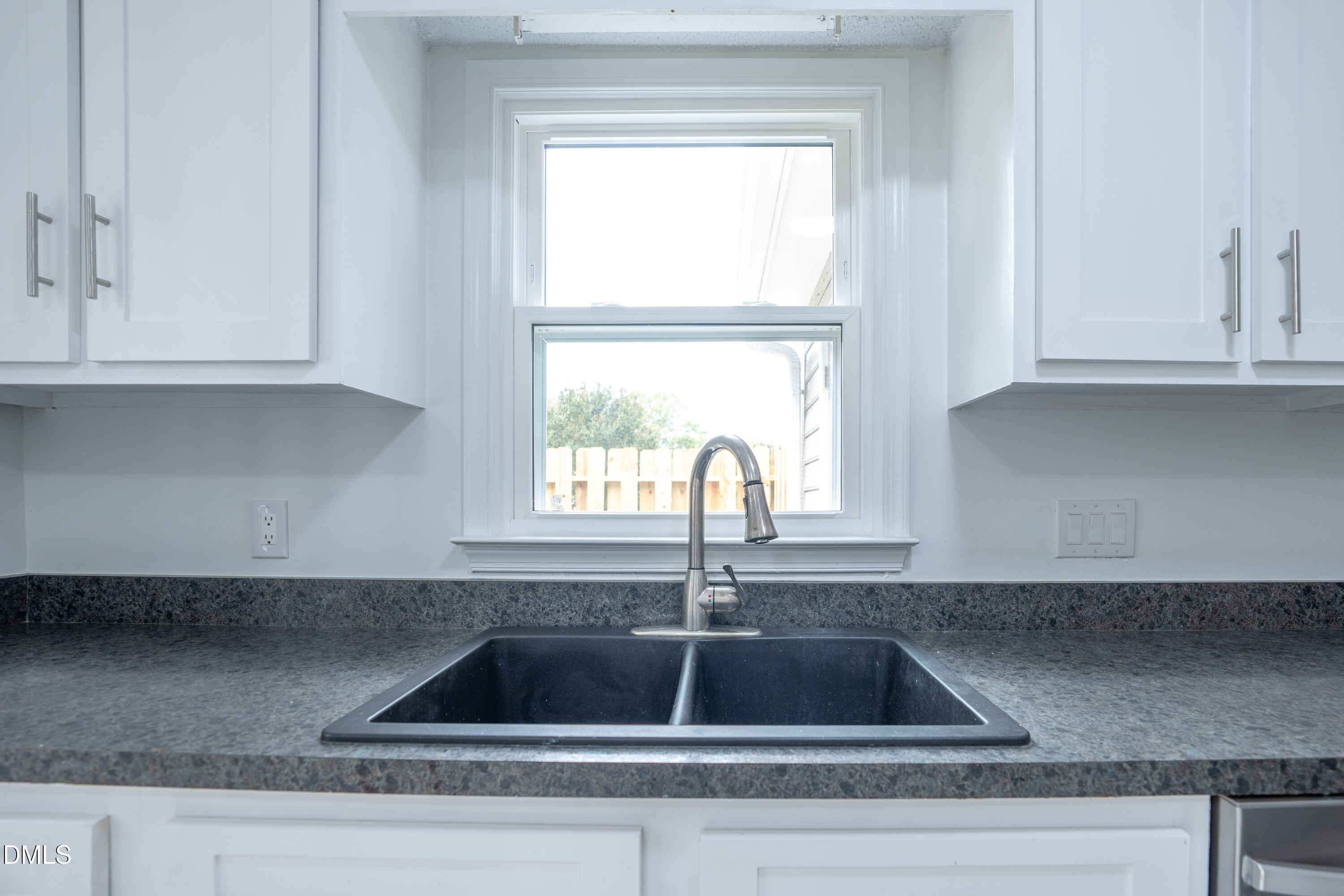 6901 Saxby Court Raleigh, NC 27613 - Photo 11 of 36 a kitchen sink with a window