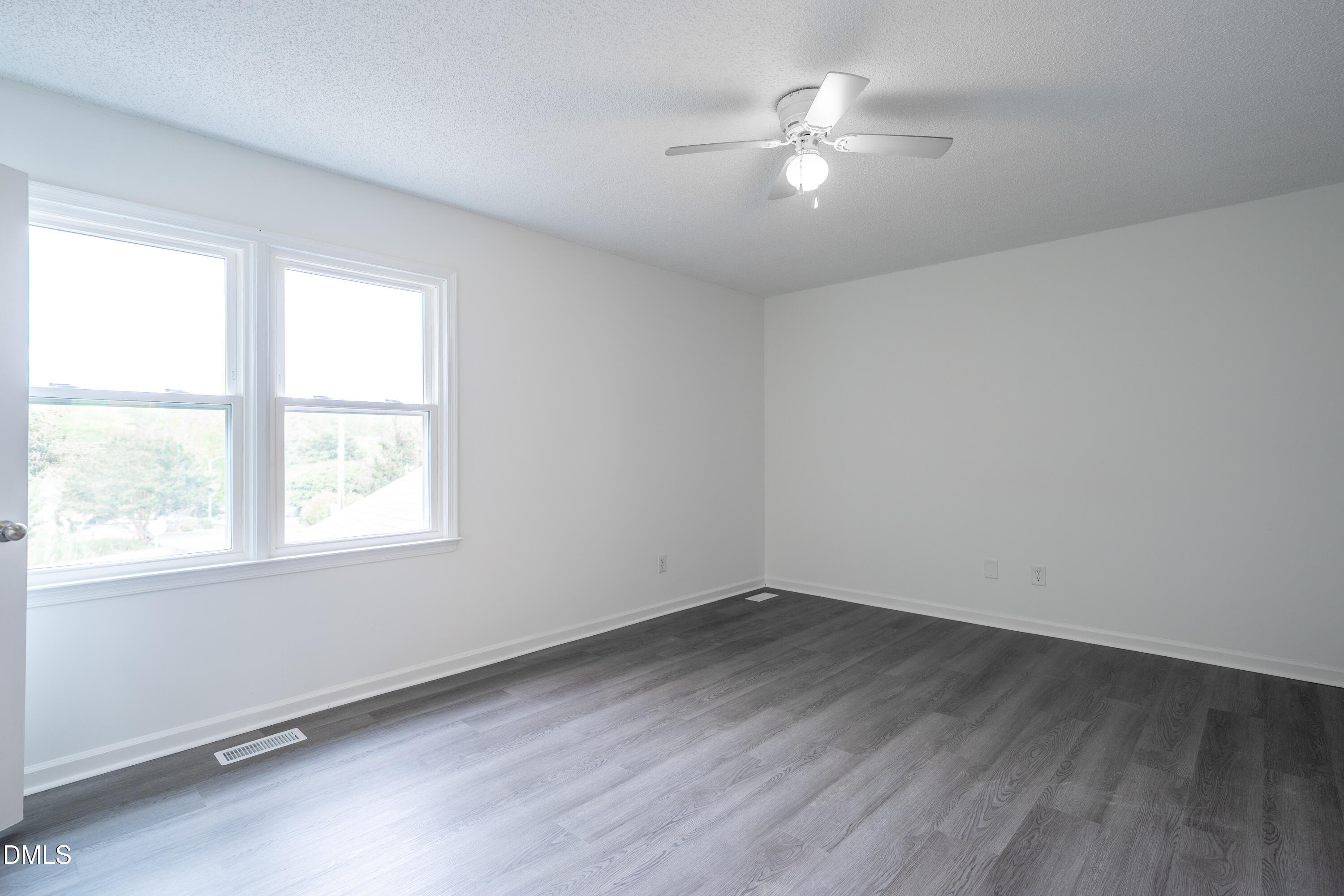 6901 Saxby Court Raleigh, NC 27613 - Photo 15 of 36 wooden floor in an empty room with a window