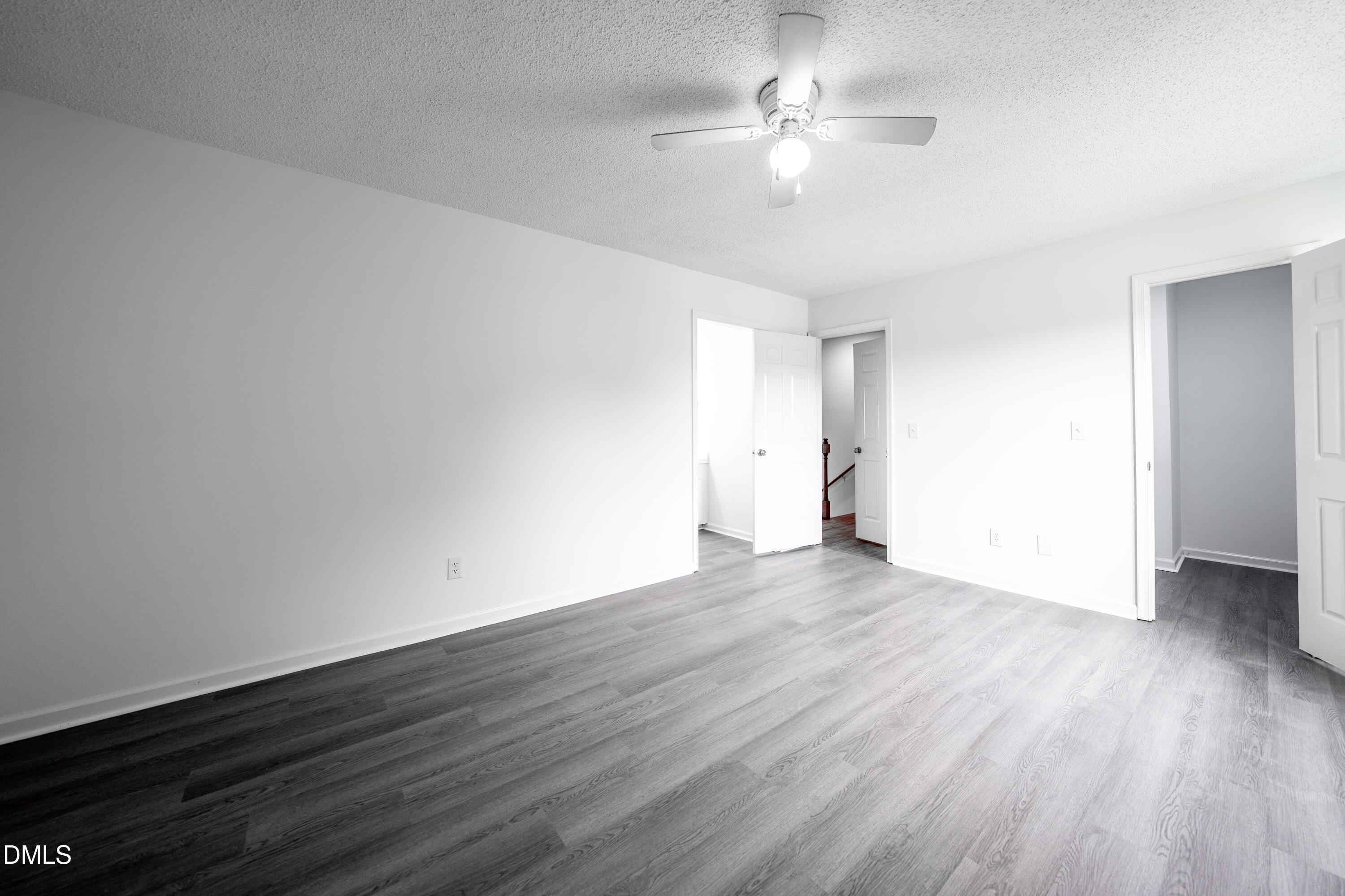6901 Saxby Court Raleigh, NC 27613 - Photo 17 of 36 a view of an empty room with wooden floor