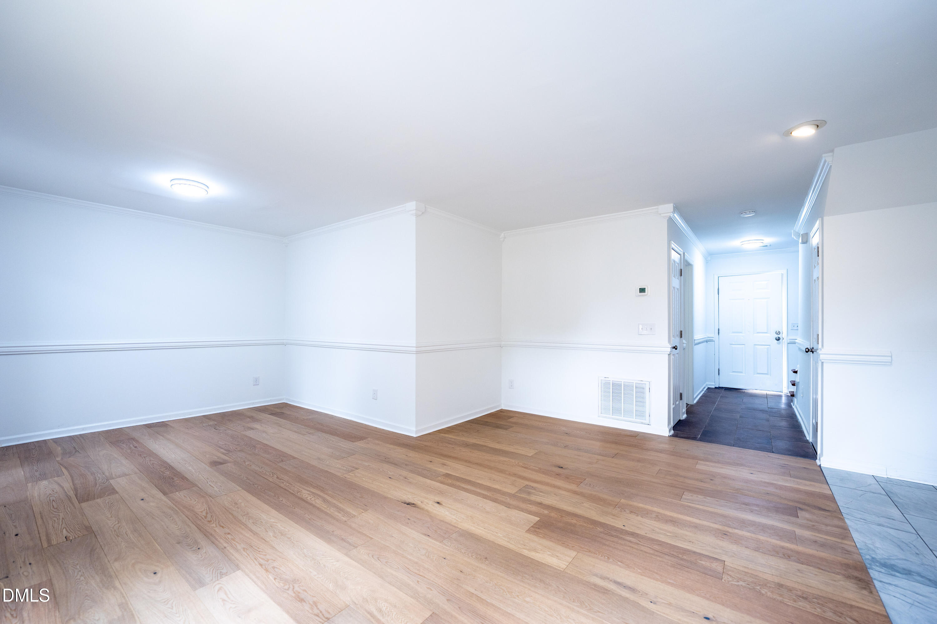 6901 Saxby Court Raleigh, NC 27613 - Photo 20 of 36 a view of empty room with wooden floor