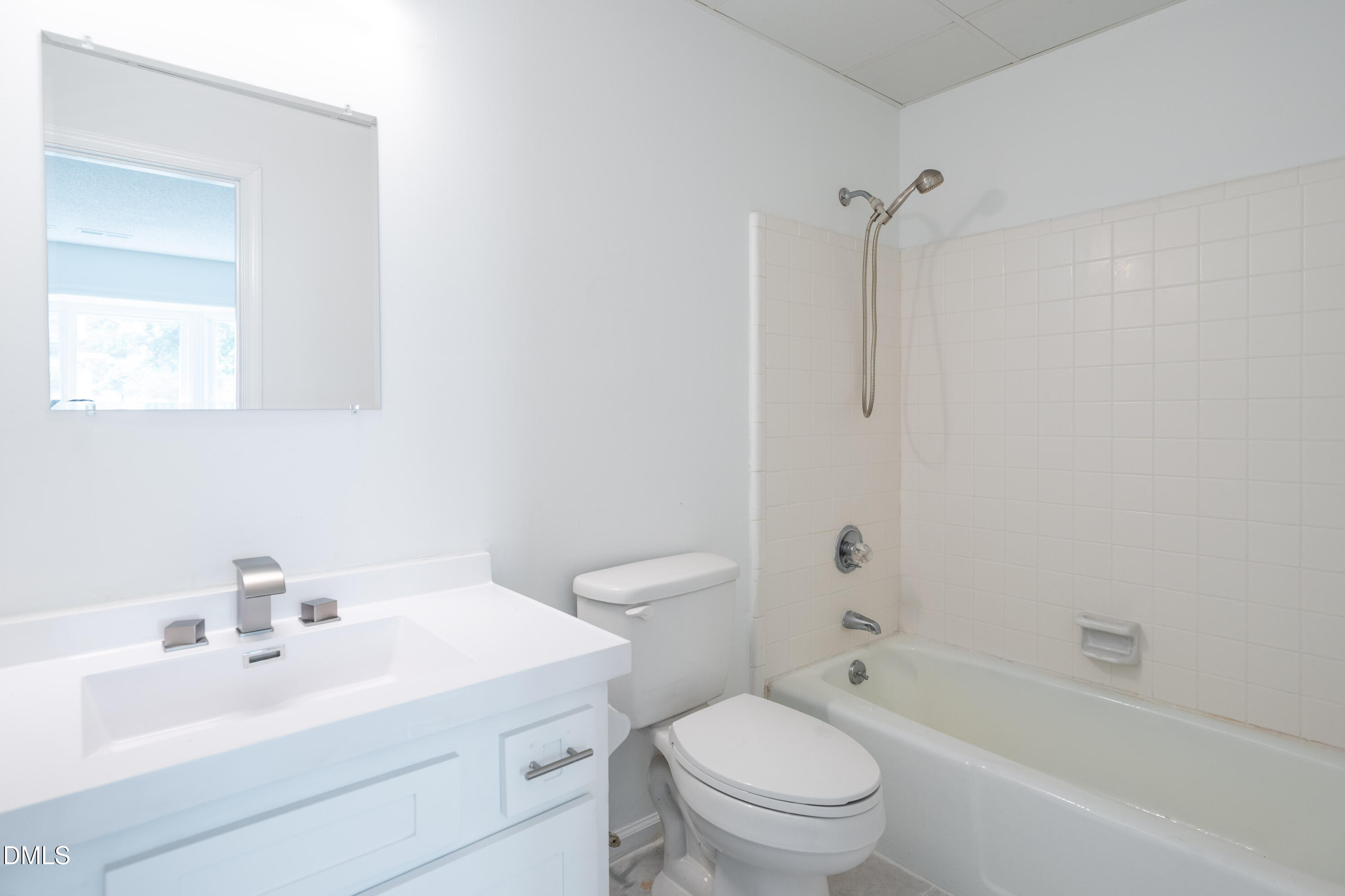 6901 Saxby Court Raleigh, NC 27613 - Photo 23 of 36 a bathroom with a sink toilet and shower