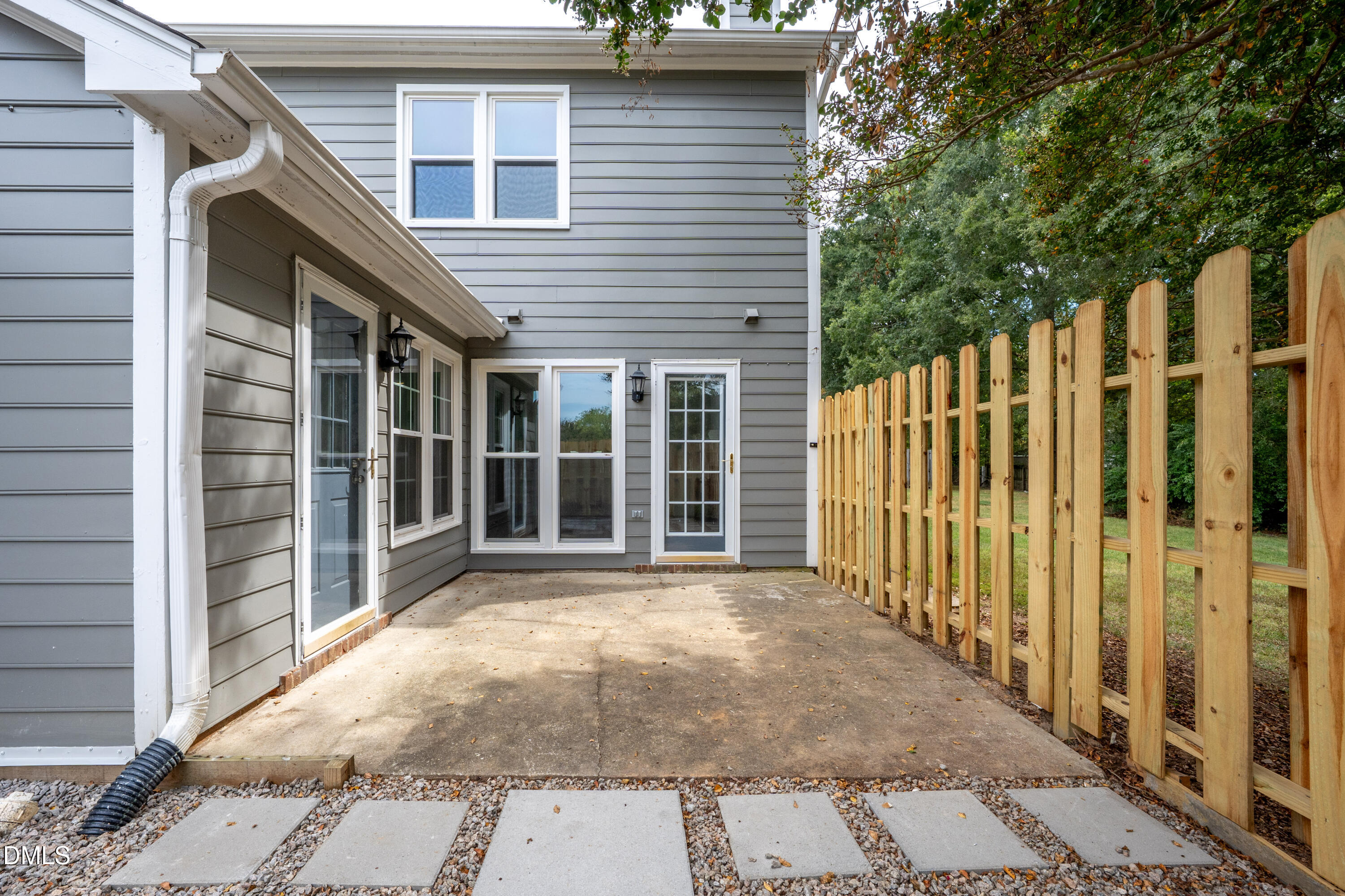 6901 Saxby Court Raleigh, NC 27613 - Photo 28 of 36 a view of a house with a wooden fence