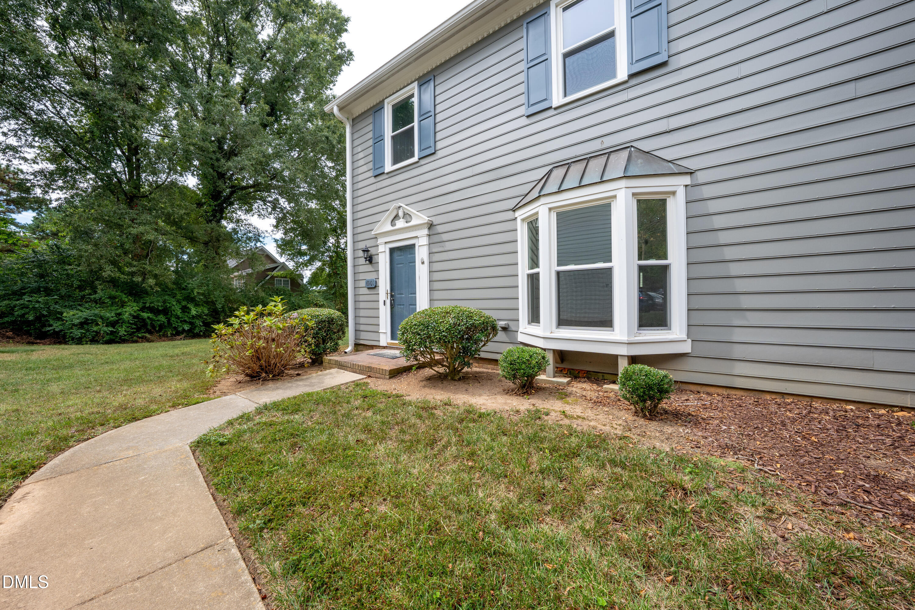 6901 Saxby Court Raleigh, NC 27613 - Photo 30 of 36 a front view of a house with garden