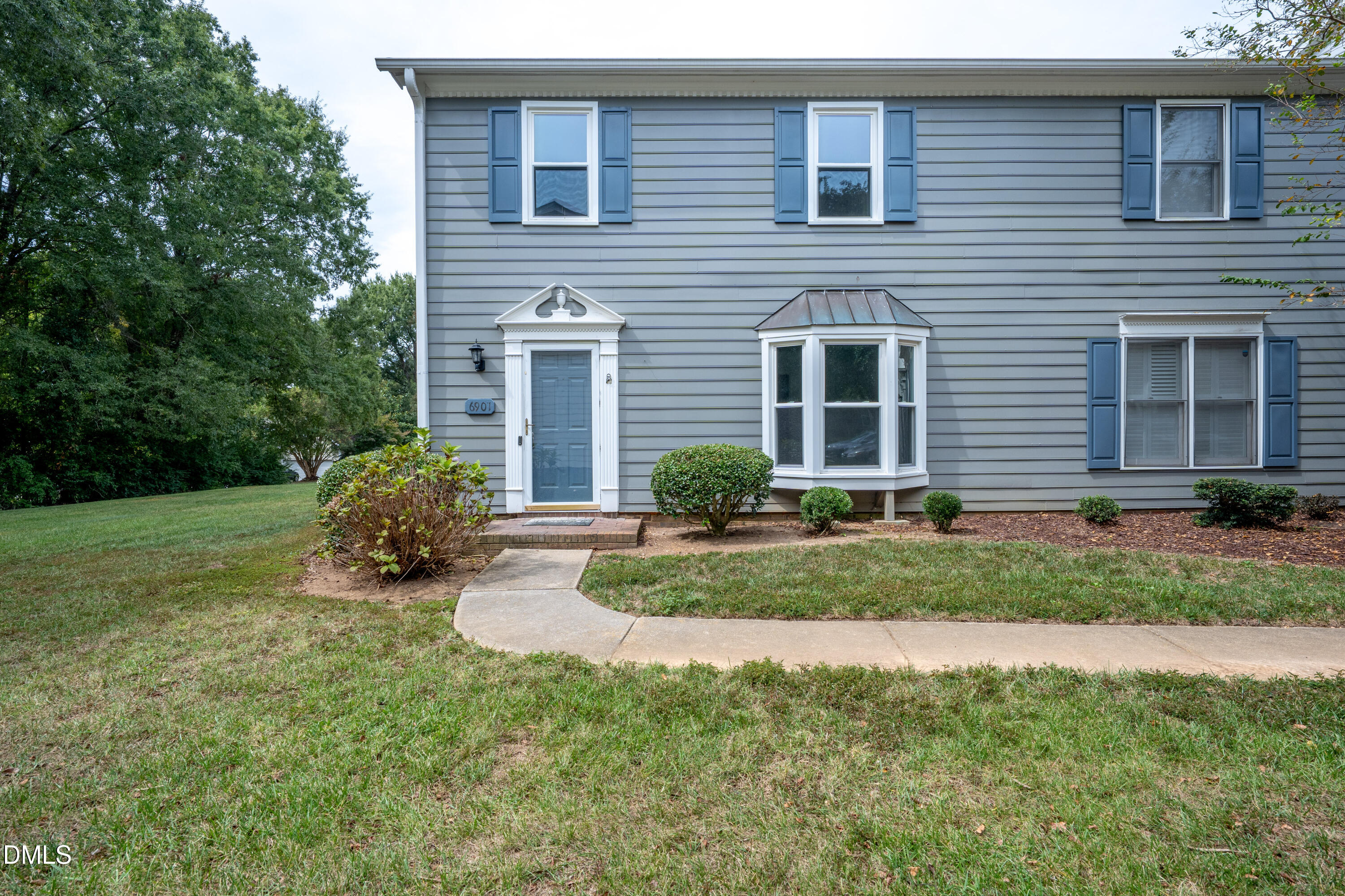 6901 Saxby Court Raleigh, NC 27613 - Photo 33 of 36 a view of a house with a yard and sitting area