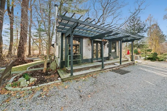 a view of a backyard with wooden fence