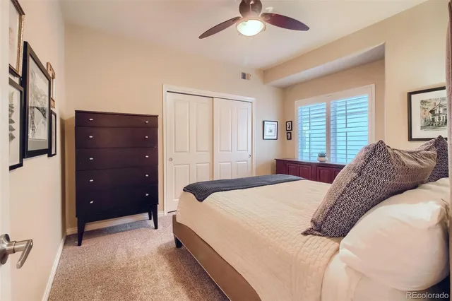 a bedroom with a bed and a couch