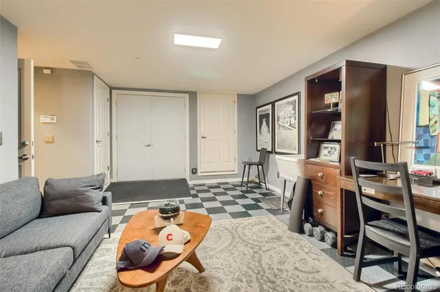 a bedroom with furniture and a window