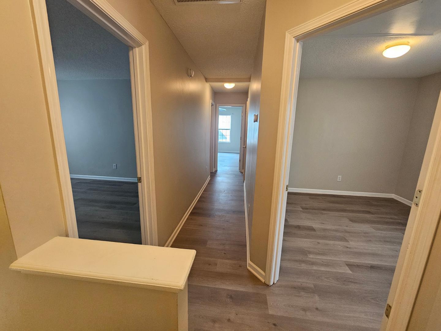 2341 Brasstown Lane Apex, NC 27502 - Photo 12 of 24 a view of hallway with wooden floor