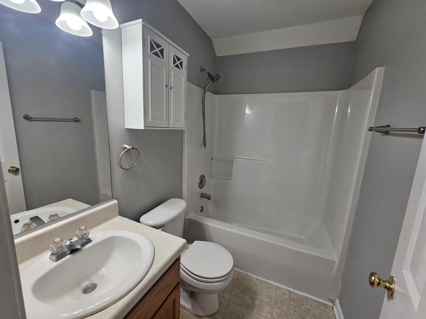 2341 Brasstown Lane Apex, NC 27502 - Photo 15 of 24 a bathroom with a sink toilet and shower