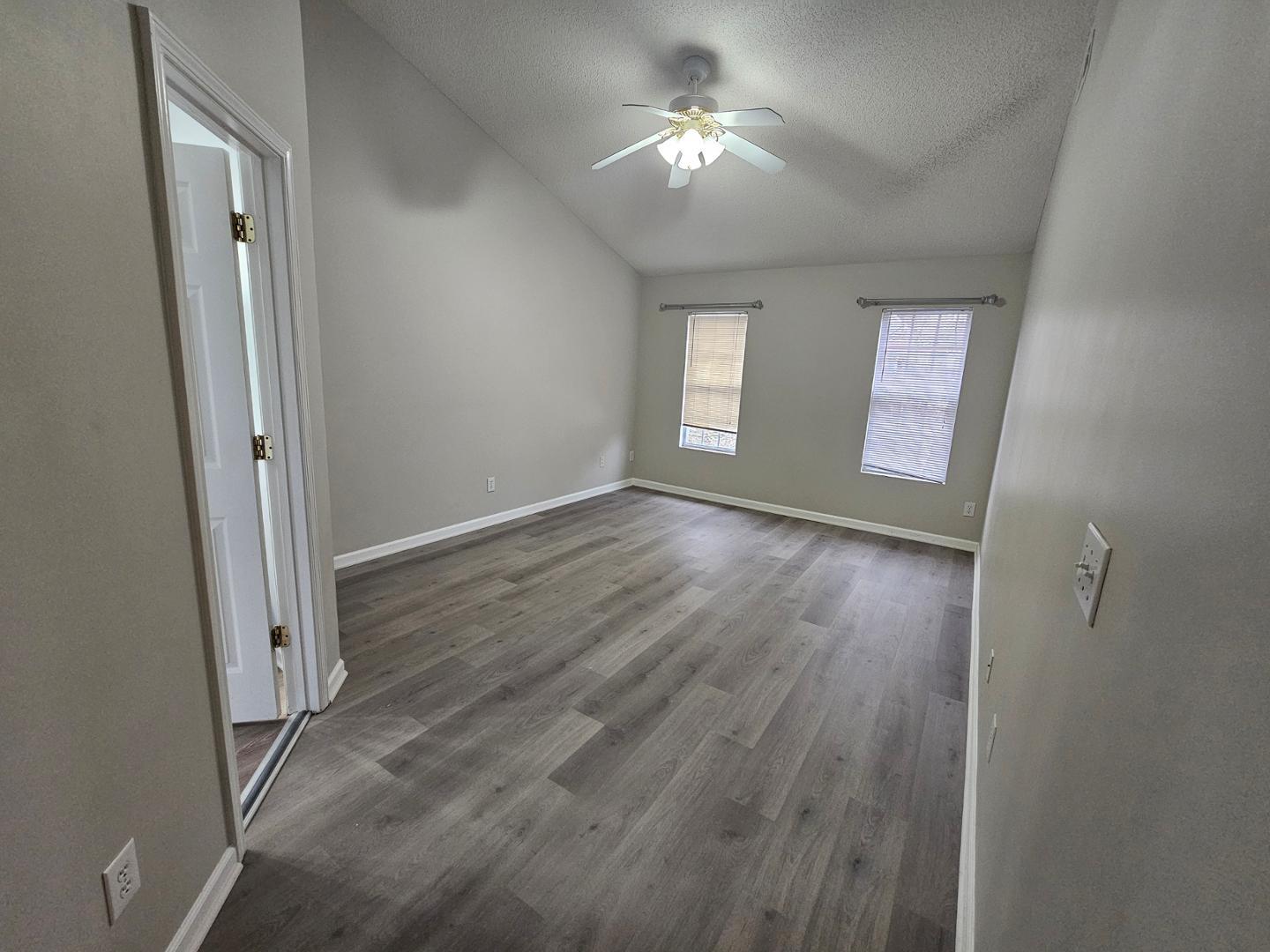 2341 Brasstown Lane Apex, NC 27502 - Photo 17 of 24 a view of empty room with window and wooden floor