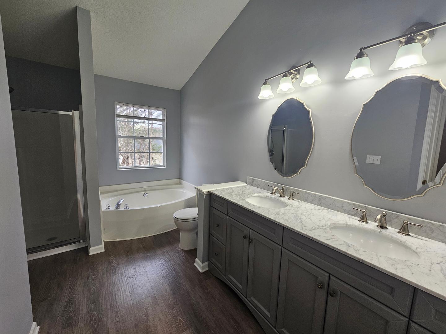 2341 Brasstown Lane Apex, NC 27502 - Photo 20 of 24 a bathroom with a double vanity sink and a mirror