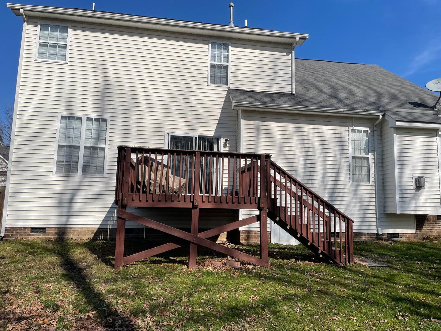 2341 Brasstown Lane Apex, NC 27502 - Photo 21 of 24 a view of wooden house with a yard