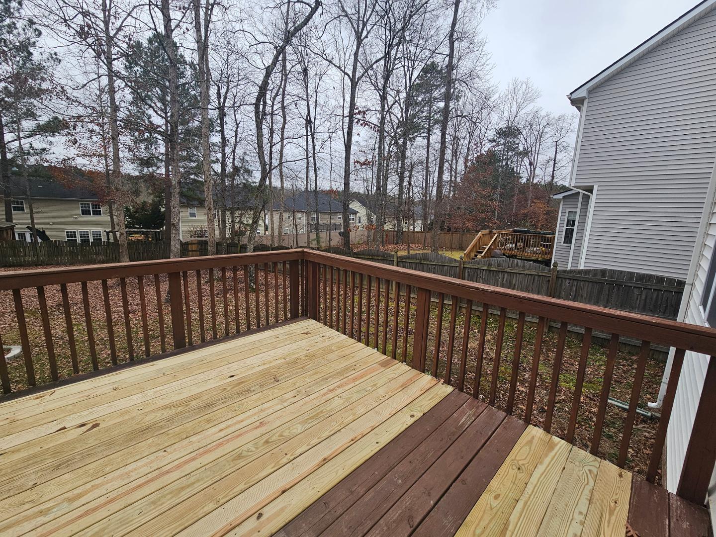 2341 Brasstown Lane Apex, NC 27502 - Photo 23 of 24 a balcony with wooden floor and fence