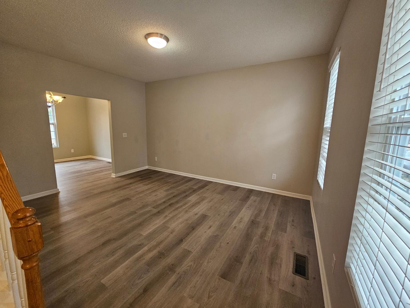2341 Brasstown Lane Apex, NC 27502 - Photo 5 of 24 wooden floor in an empty room with a window