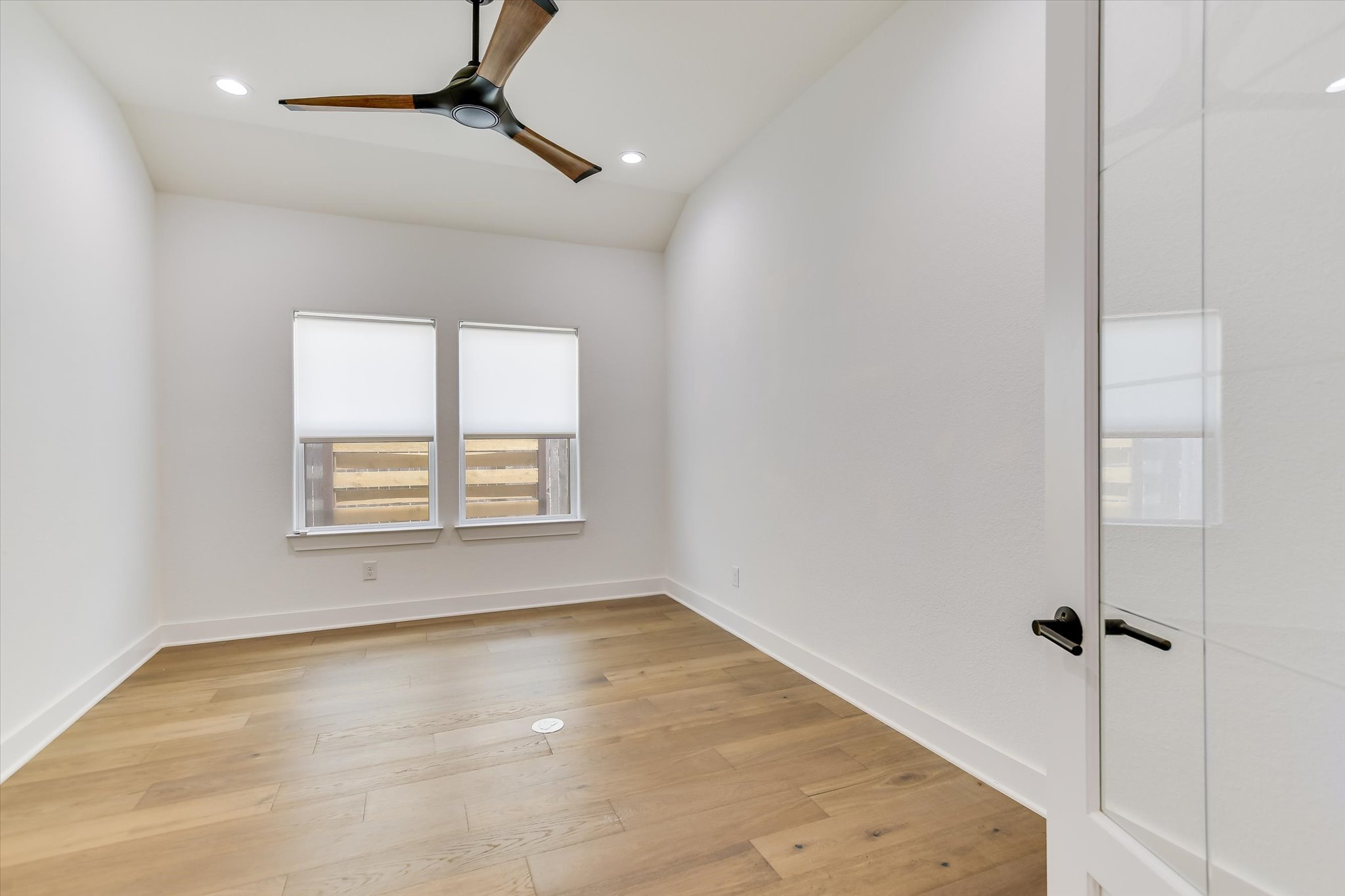 4300 Allenbrook Drive Pflugerville, TX 78660 - Photo 17 of 40 an empty room with windows and fan
