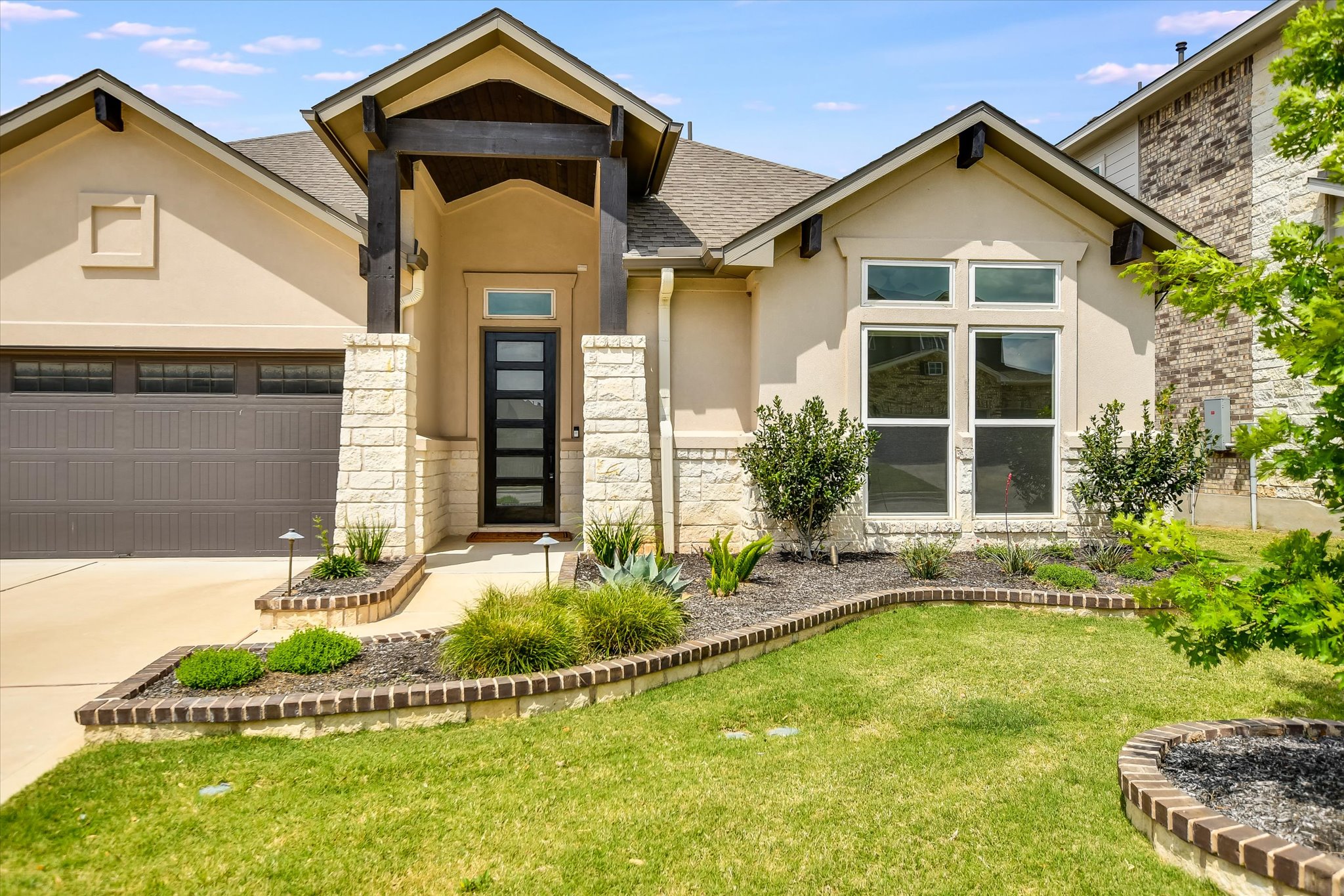 4300 Allenbrook Drive Pflugerville, TX 78660 - Photo 2 of 40 a front view of a house with a yard