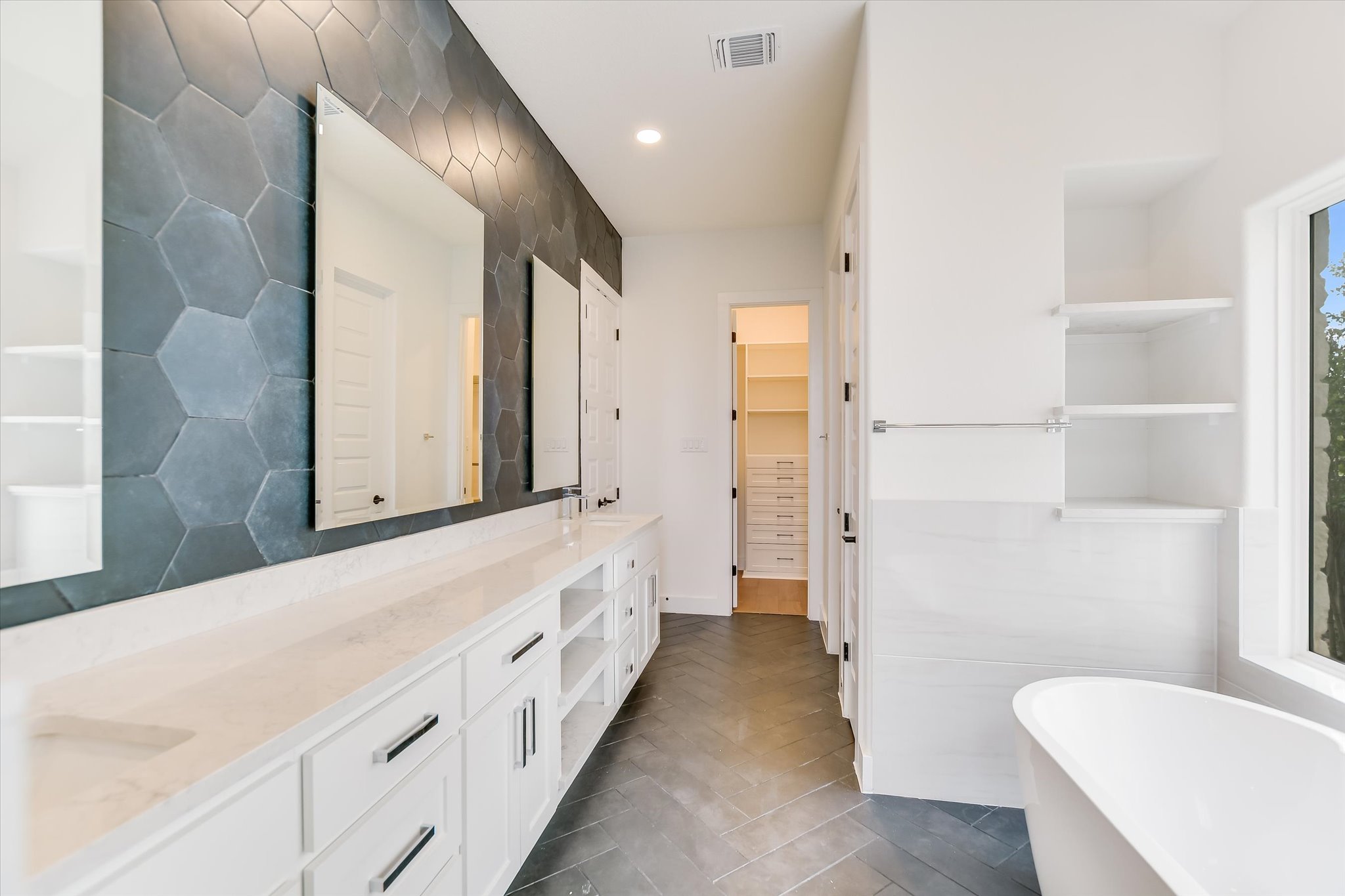 4300 Allenbrook Drive Pflugerville, TX 78660 - Photo 24 of 40 a bathroom with a double vanity sink and mirror with shower