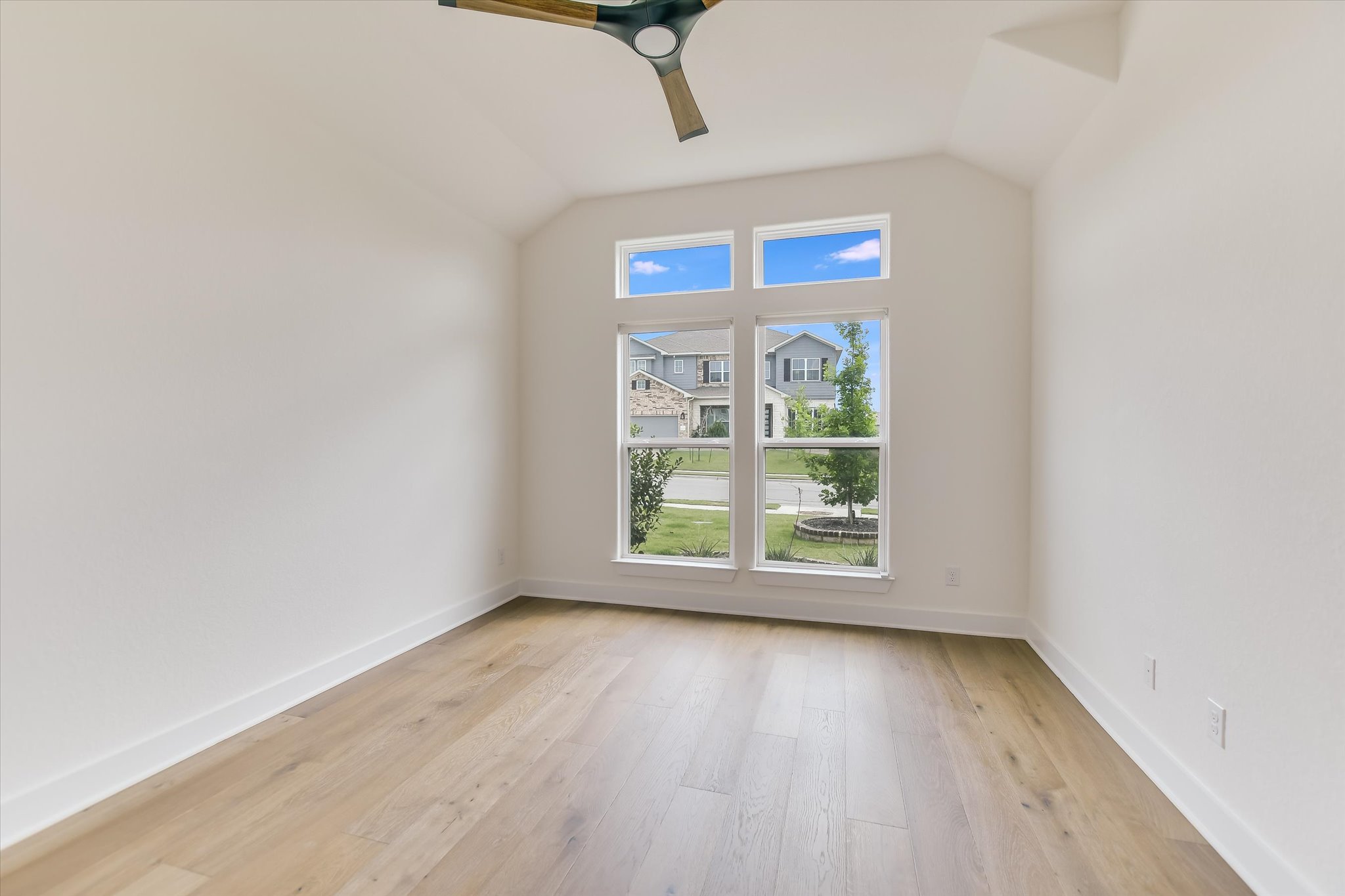 4300 Allenbrook Drive Pflugerville, TX 78660 - Photo 28 of 40 an empty room with wooden floor and windows