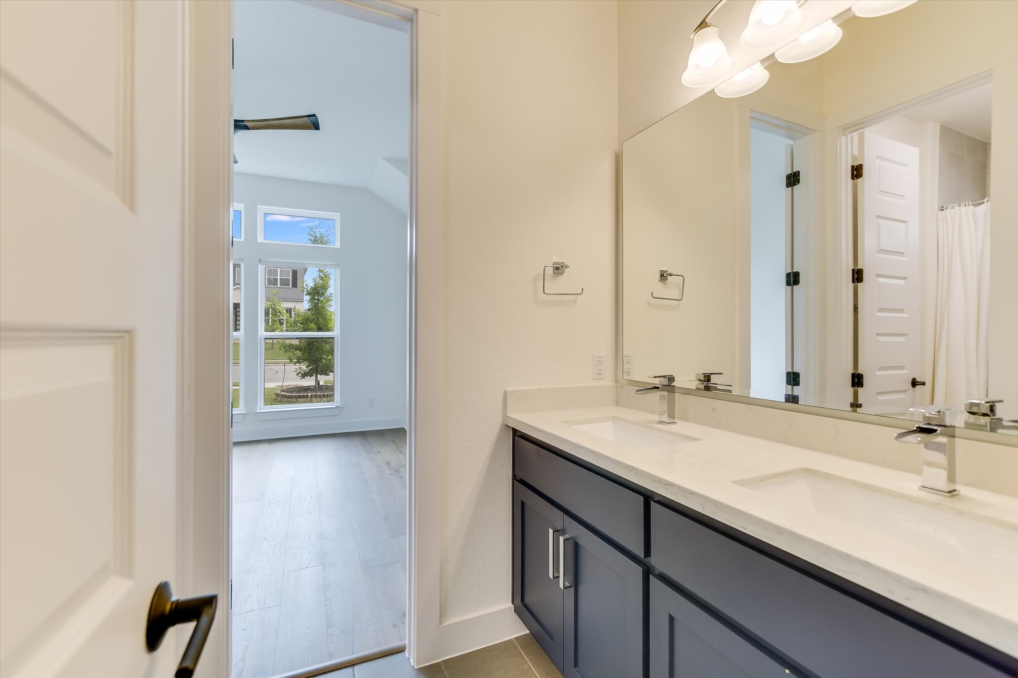 4300 Allenbrook Drive Pflugerville, TX 78660 - Photo 31 of 40 a bathroom with a sink and a mirror