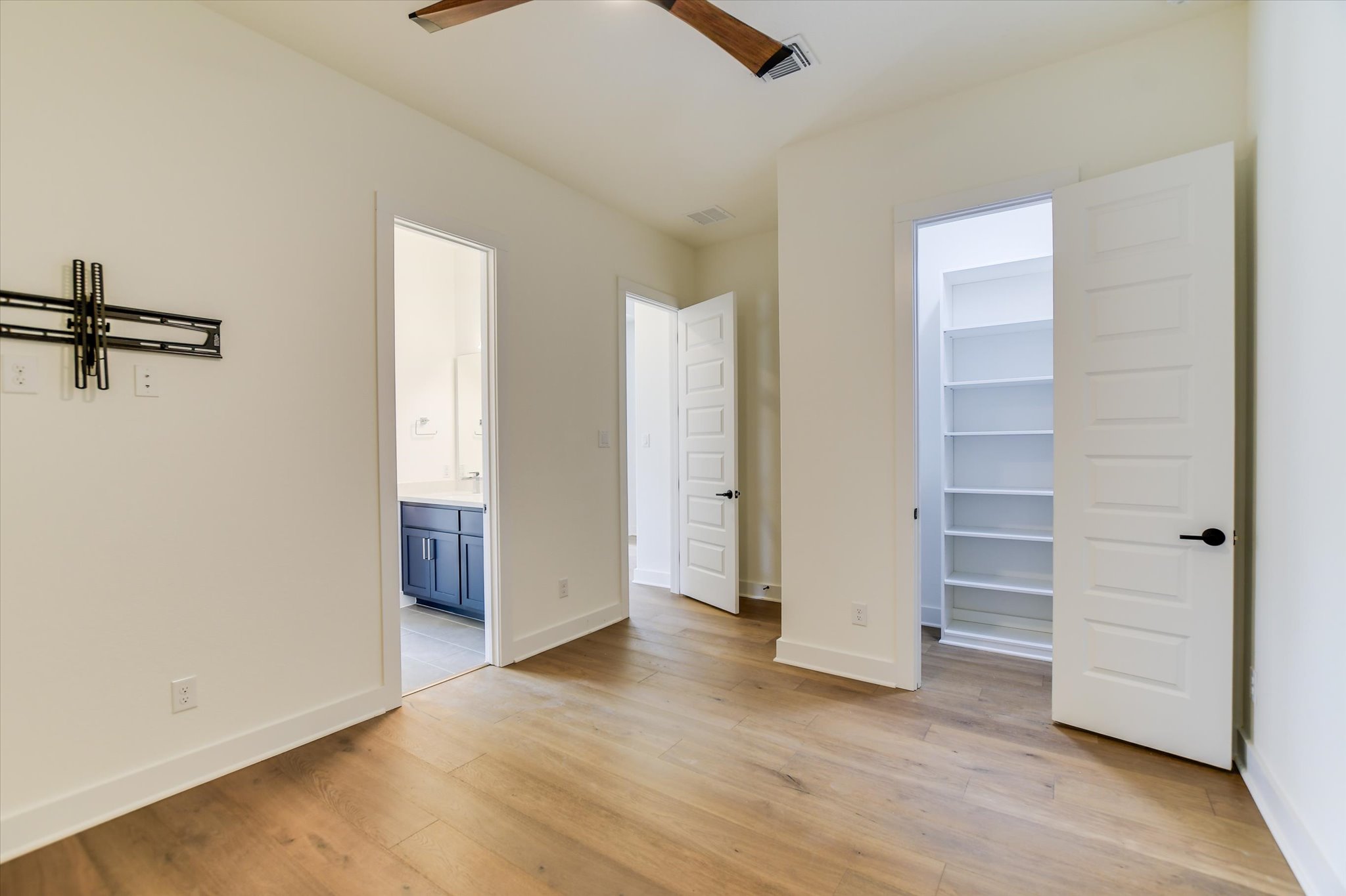 4300 Allenbrook Drive Pflugerville, TX 78660 - Photo 33 of 40 an empty room with closet and wooden floor