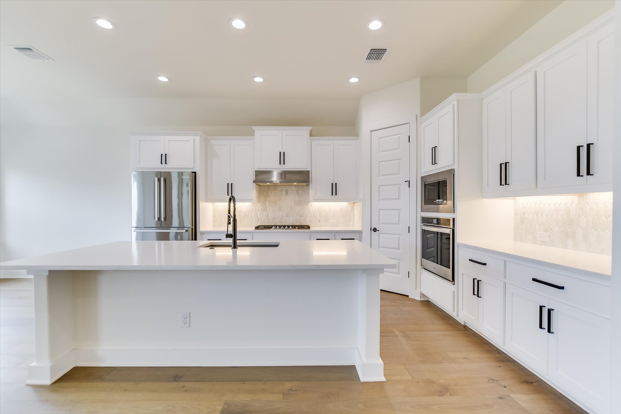 4300 Allenbrook Drive Pflugerville, TX 78660 - Photo 7 of 40 a large kitchen with stainless steel appliances lots of counter top space