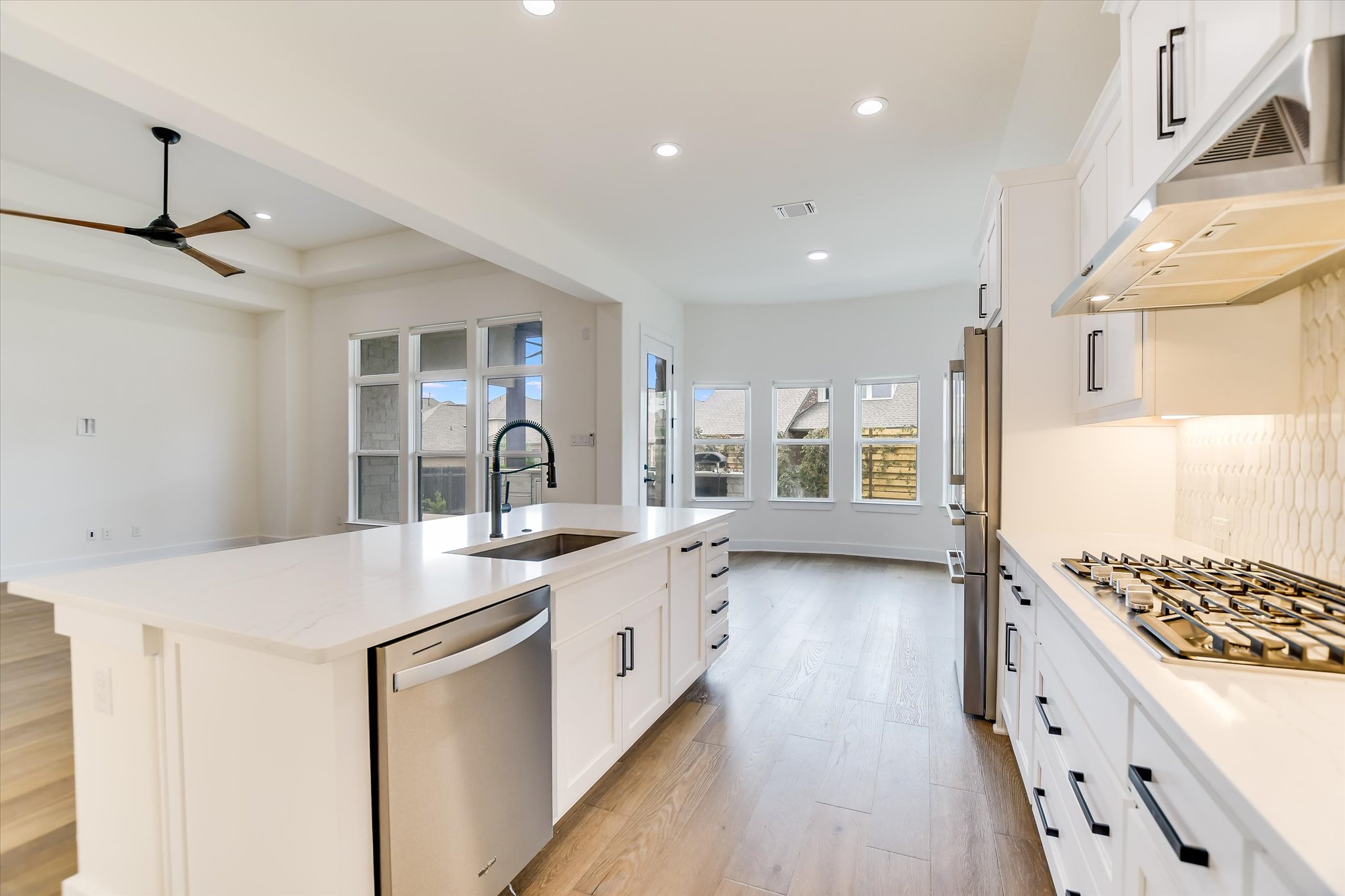 4300 Allenbrook Drive Pflugerville, TX 78660 - Photo 9 of 40 a kitchen with sink stove and cabinets