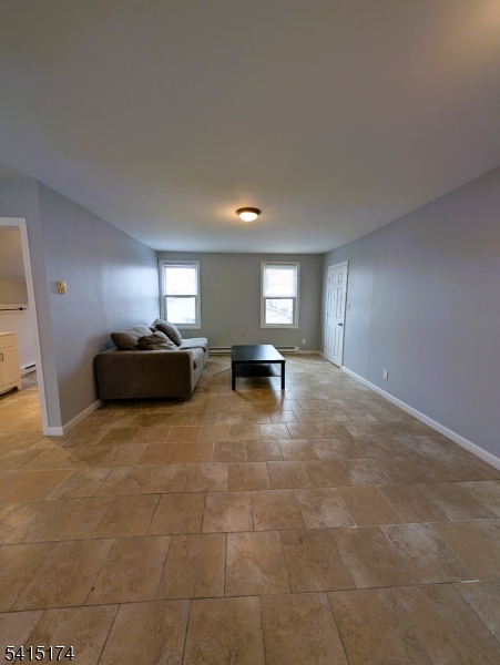 a view of livingroom with furniture and windows