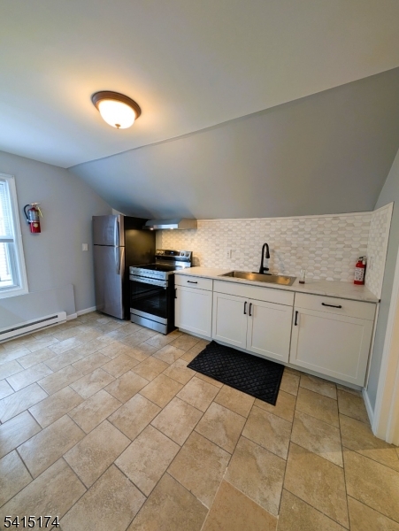 437 East 21st Street Paterson, NJ 07513 - Photo 4 of 12 a kitchen with a sink and cabinets