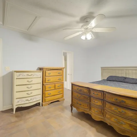 a room with furniture and a dresser
