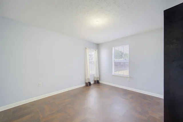 an empty room with windows