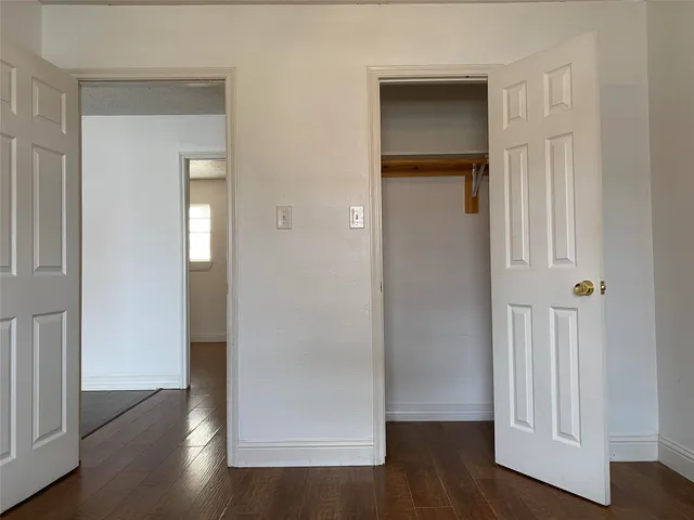a view of a livingroom with wooden floor