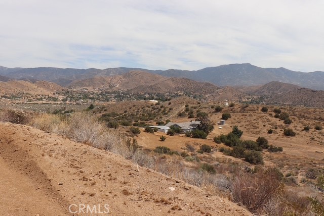 0 Brogan Road Acton, CA 93510 - Photo 12 of 19 a view of a lake with mountains in the background