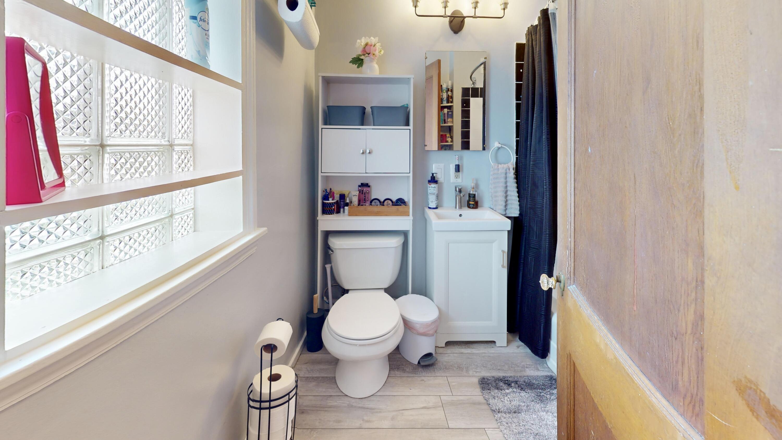 7335 Tapper Avenue Hammond, IN 46324 - Photo 20 of 36 a white toilet sitting next to a bathroom sink