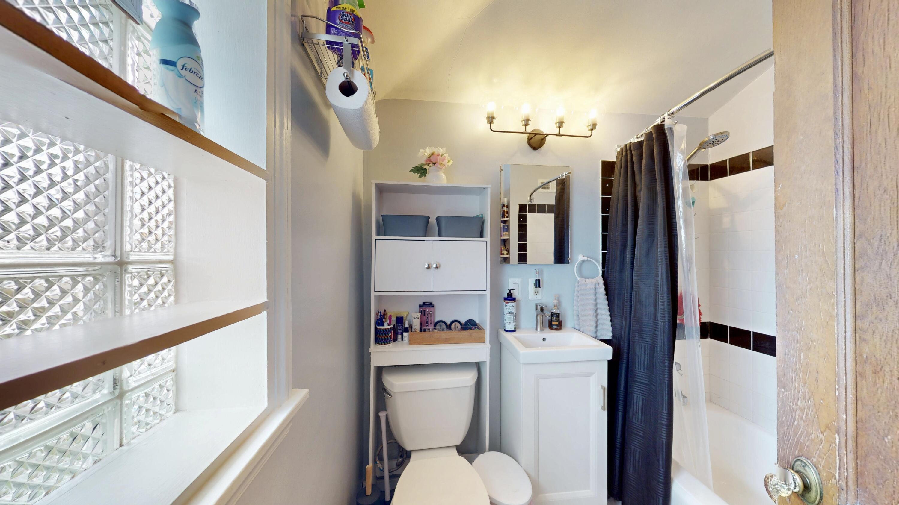 7335 Tapper Avenue Hammond, IN 46324 - Photo 21 of 36 a bathroom with a sink vanity mirror and toilet