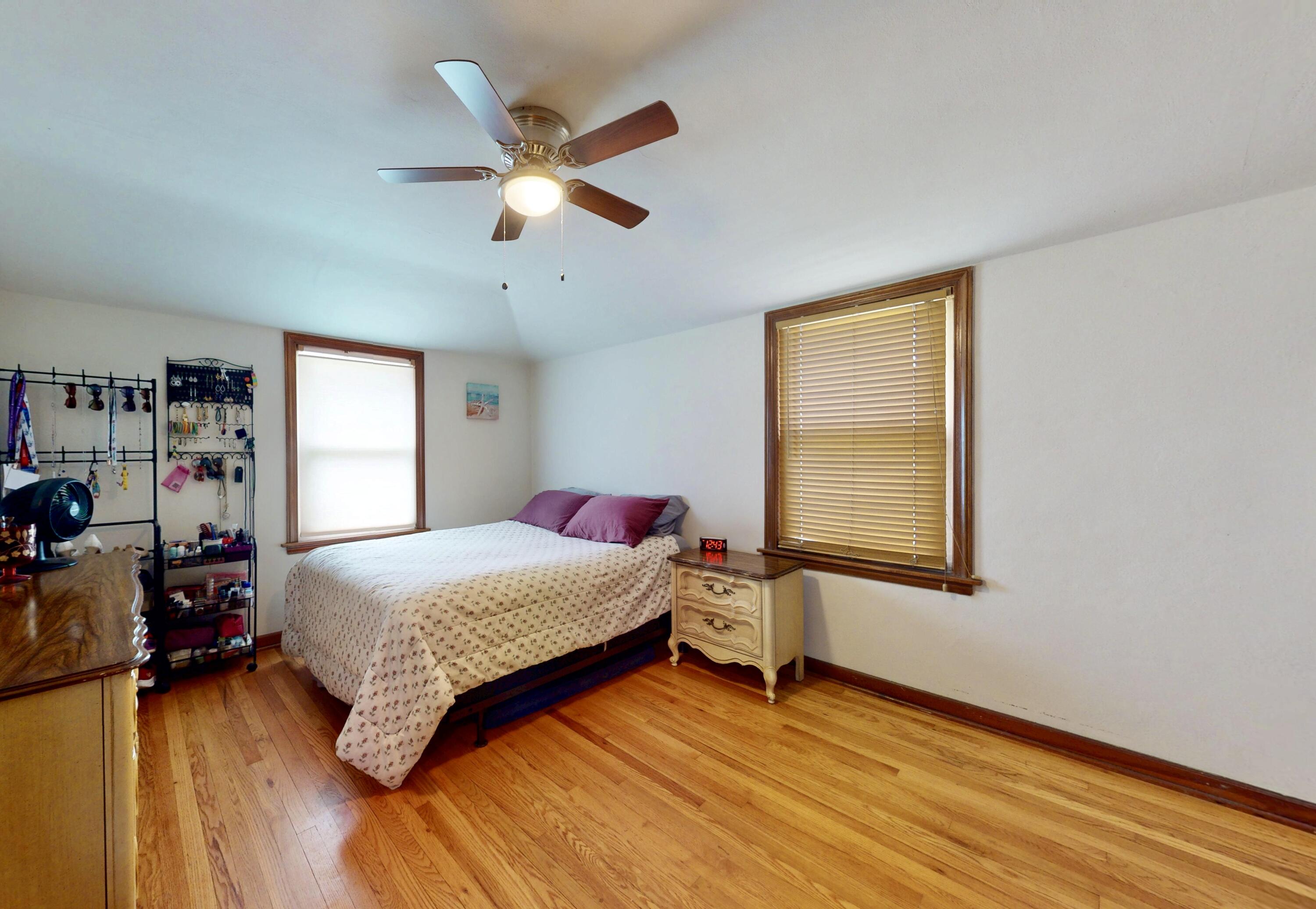 7335 Tapper Avenue Hammond, IN 46324 - Photo 23 of 36 a bedroom with a bed and wooden floor