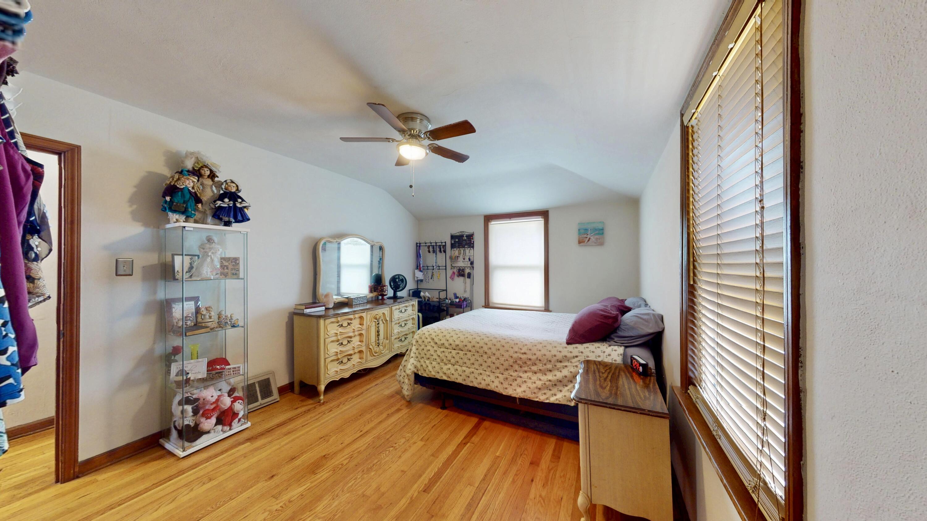 7335 Tapper Avenue Hammond, IN 46324 - Photo 24 of 36 a bedroom with bed and wooden floor