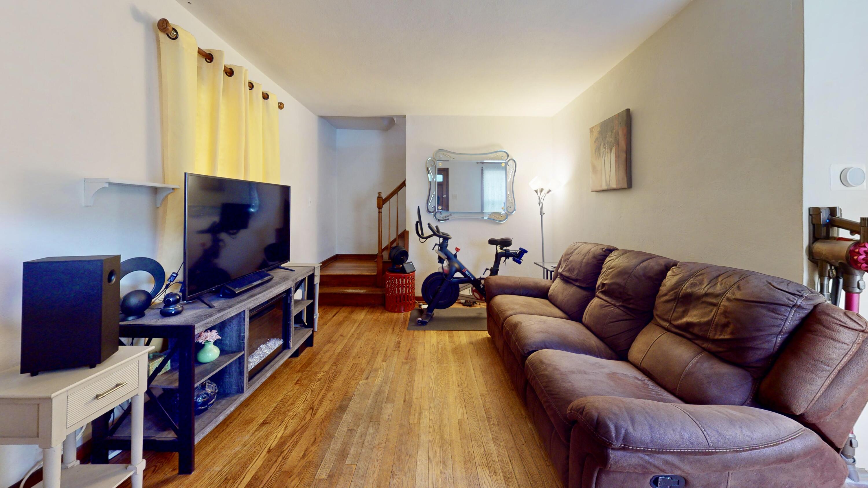 7335 Tapper Avenue Hammond, IN 46324 - Photo 4 of 36 a living room with furniture windows and a flat screen tv