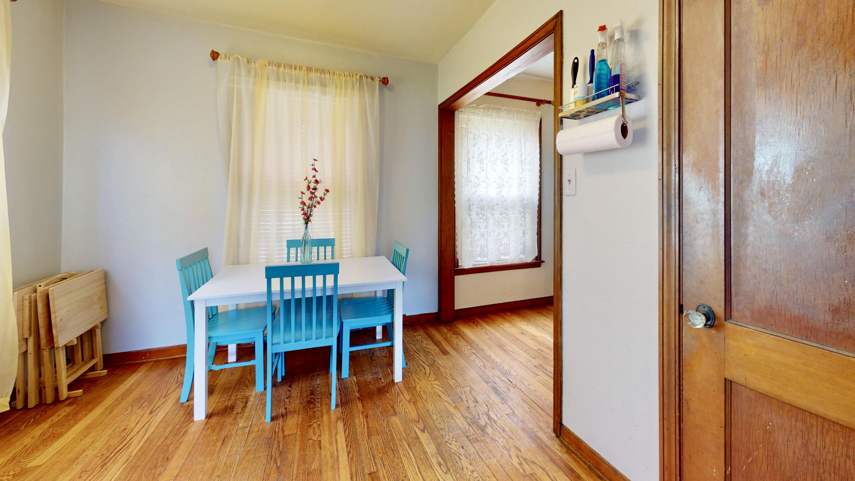 7335 Tapper Avenue Hammond, IN 46324 - Photo 10 of 36 a view of a dining room with furniture and wooden floor