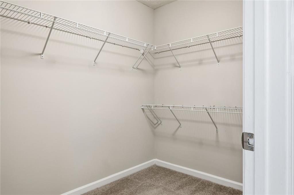 3570 Bogan Mill Road Northeast Buford, GA 30519 - Photo 24 of 31 a view of a room with racks on the wall