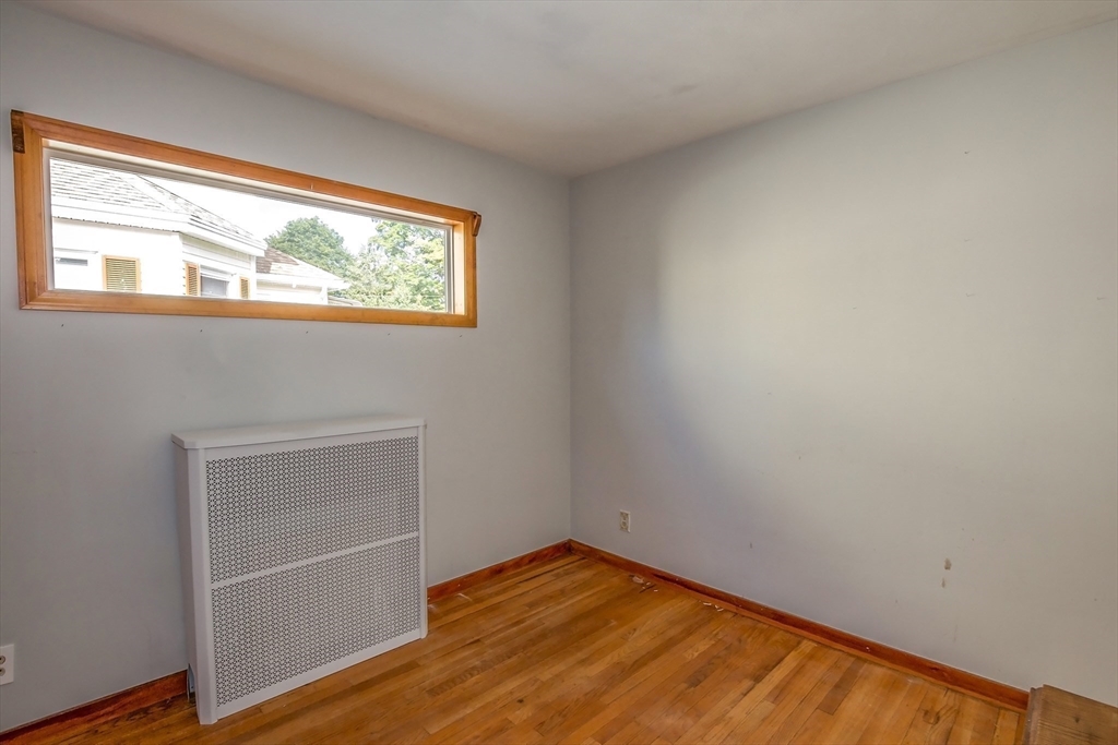 2 Admiral Street Easthampton, MA 01027 - Photo 12 of 21 a view of an empty room with wooden floor and a window