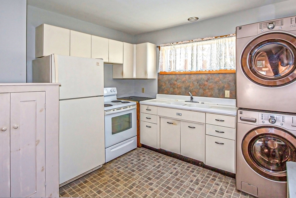 2 Admiral Street Easthampton, MA 01027 - Photo 3 of 21 a kitchen with a stove top oven sink and cabinets